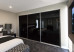 Slim Line Framed Sliding Wardrobe Doors Black Glass Finish
